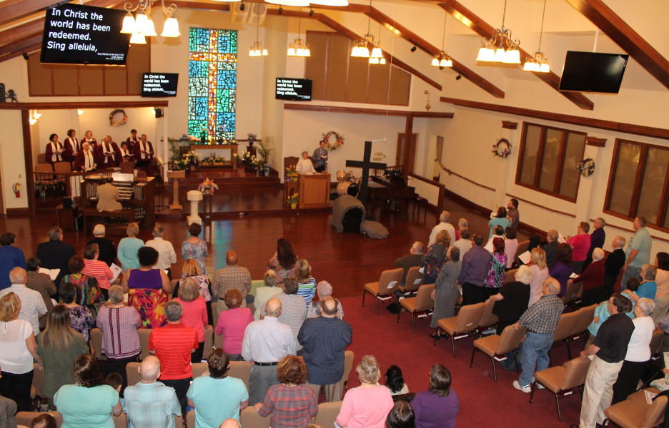 Attendees during worship standing pic from above